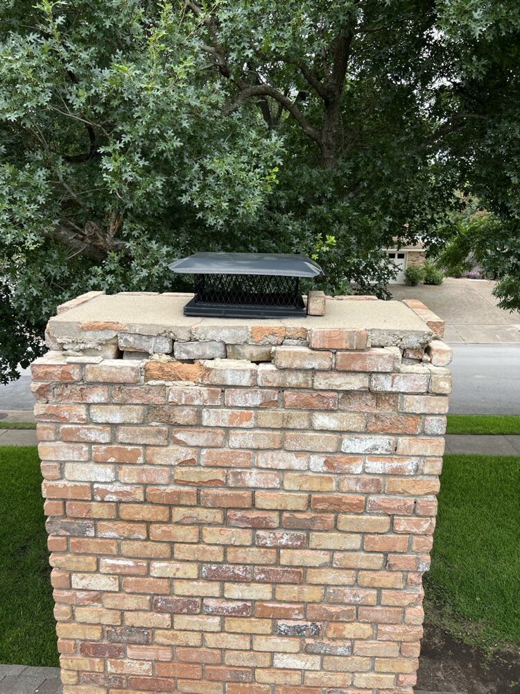Roof-level view of a chimney crown repair