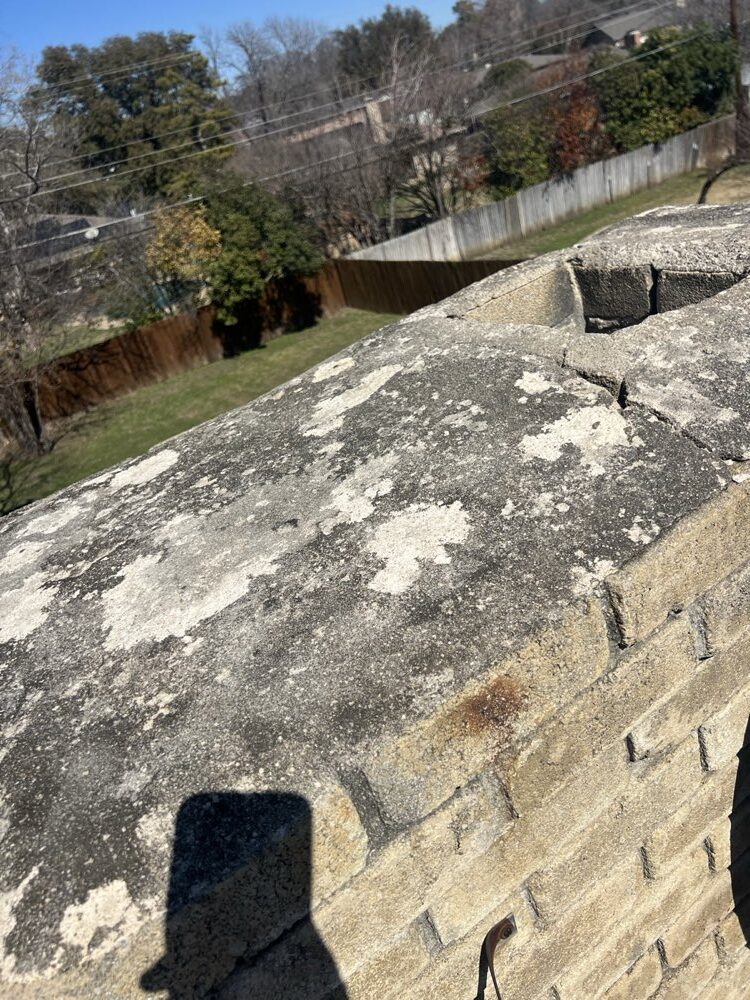 Rebuilt concrete crown on a masonry chimney