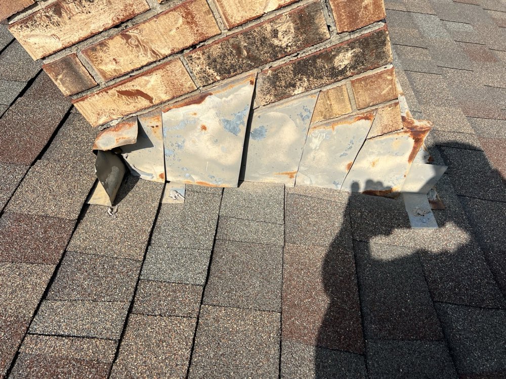 Roof-to-chimney joint before reflashing