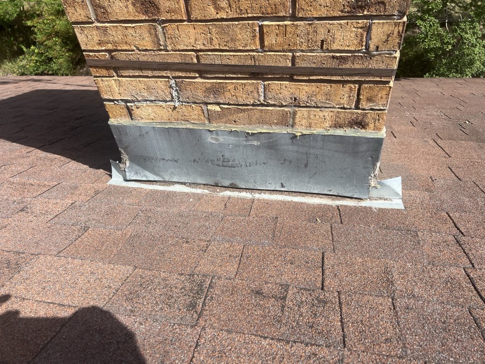 Sealed counter flashing on a DFW chimney