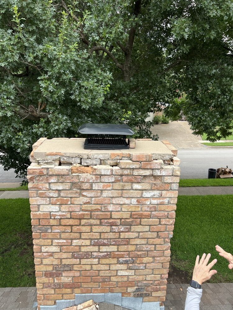 New brick courses laid during chimney rebuild